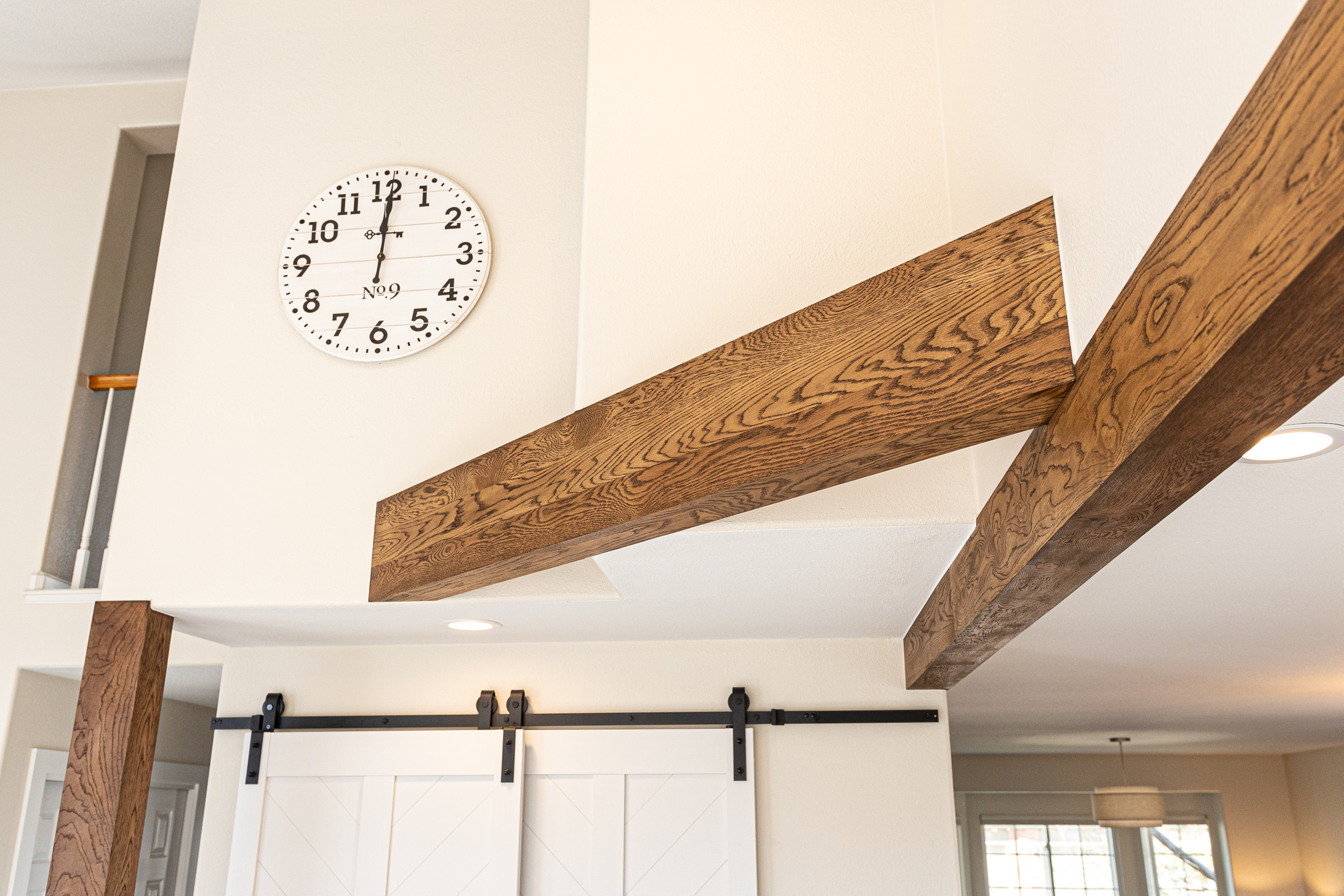 White kitchen range hood with wood trim